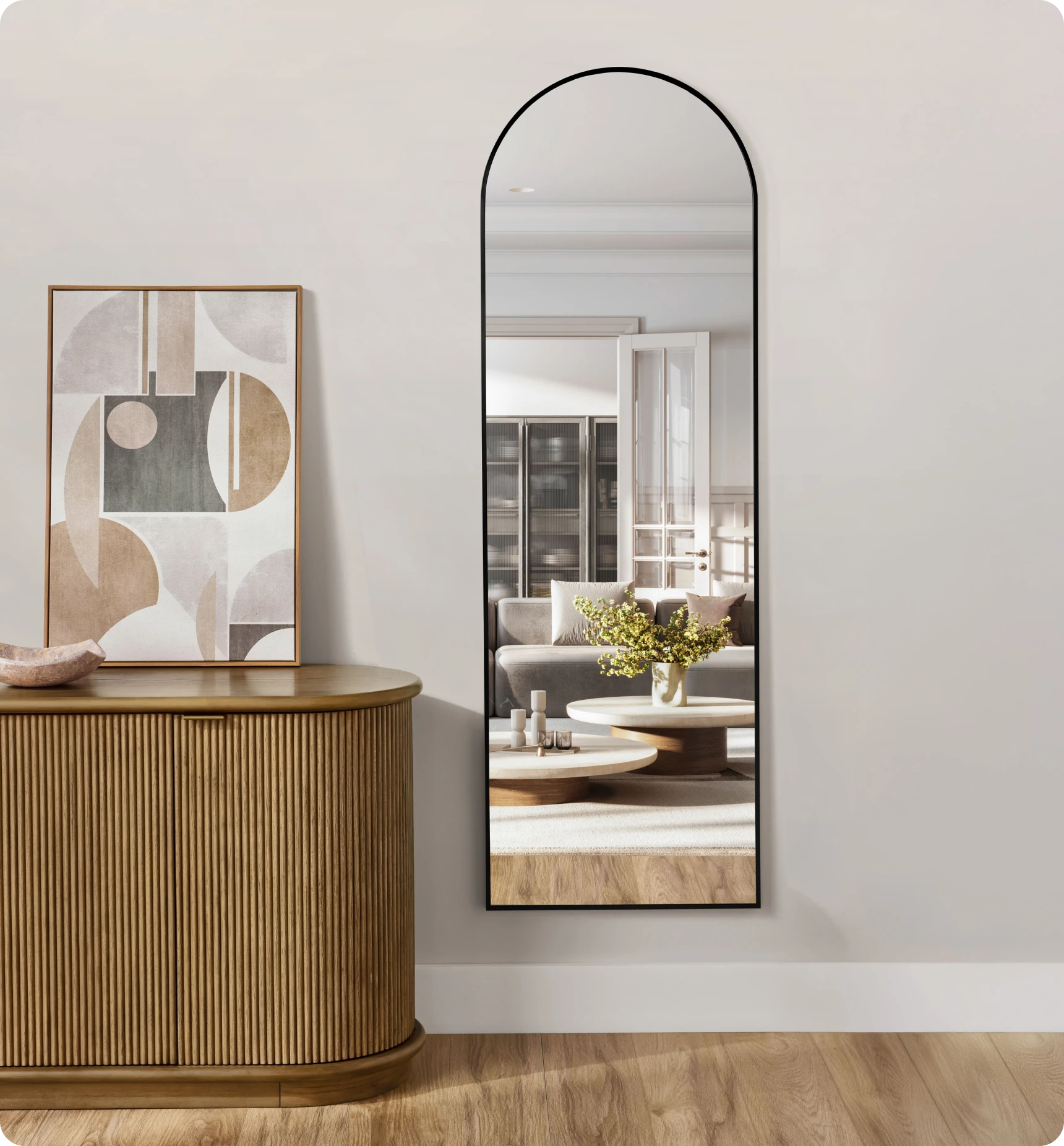 Tall mirror beside abstract artwork